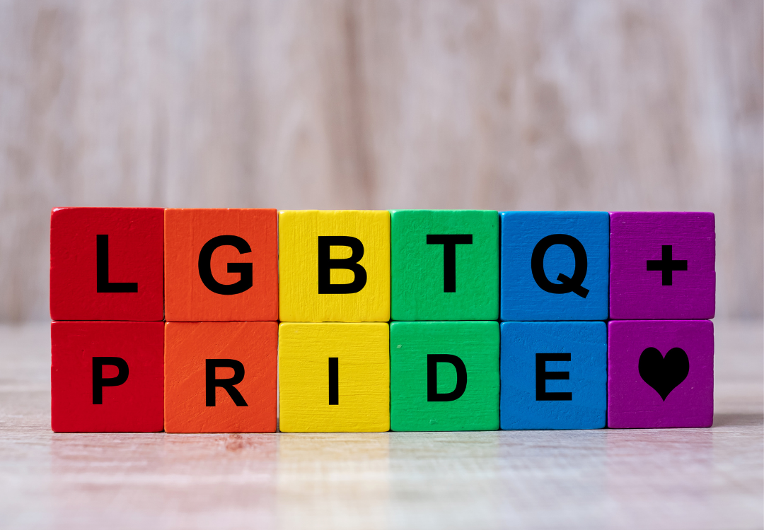 Colored blocks aligned to make a rainbow state LGBTQ plus PRIDE heart symbol.