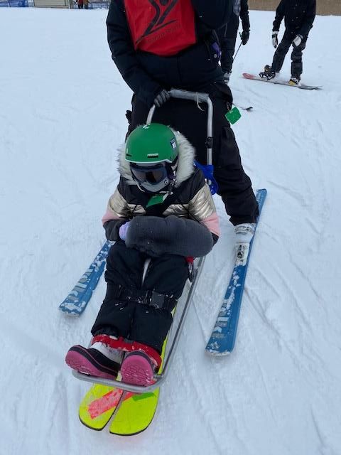 Person participating in adaptive skiing