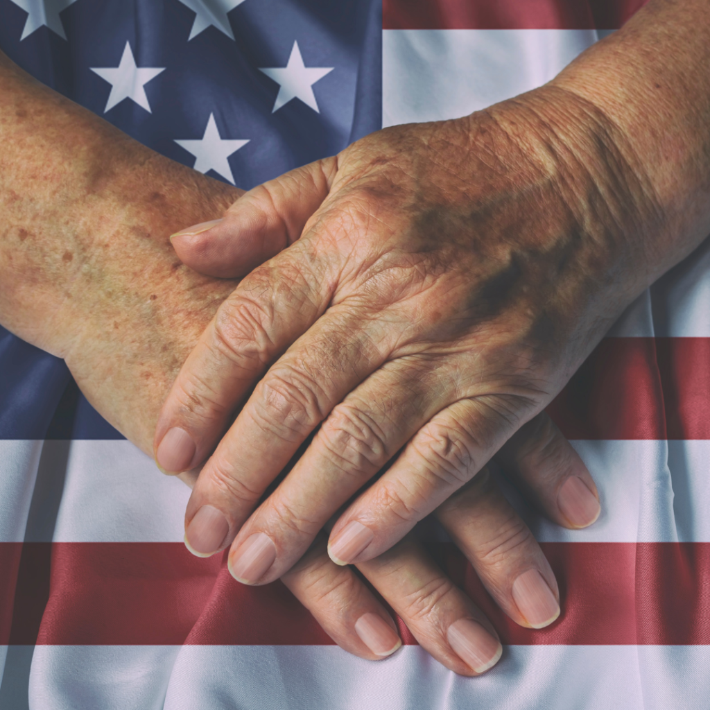 Veteran's hands placed with US Flag