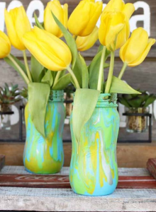 Paint pouring vase with flowers